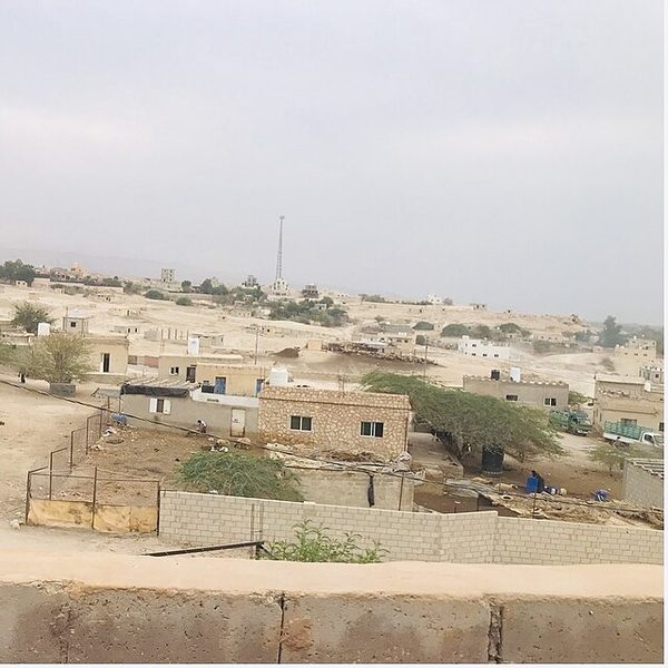 Bare desert land and houses in the Dead Sea Valley, Jordan